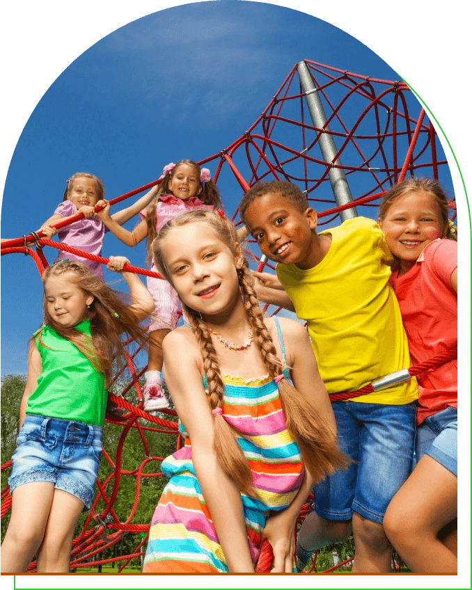 A group of children on a playground with a slide.